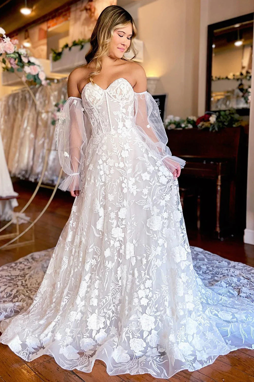 A-Line sweetheart corset lace wedding dress with detachable long sleeves, front view.