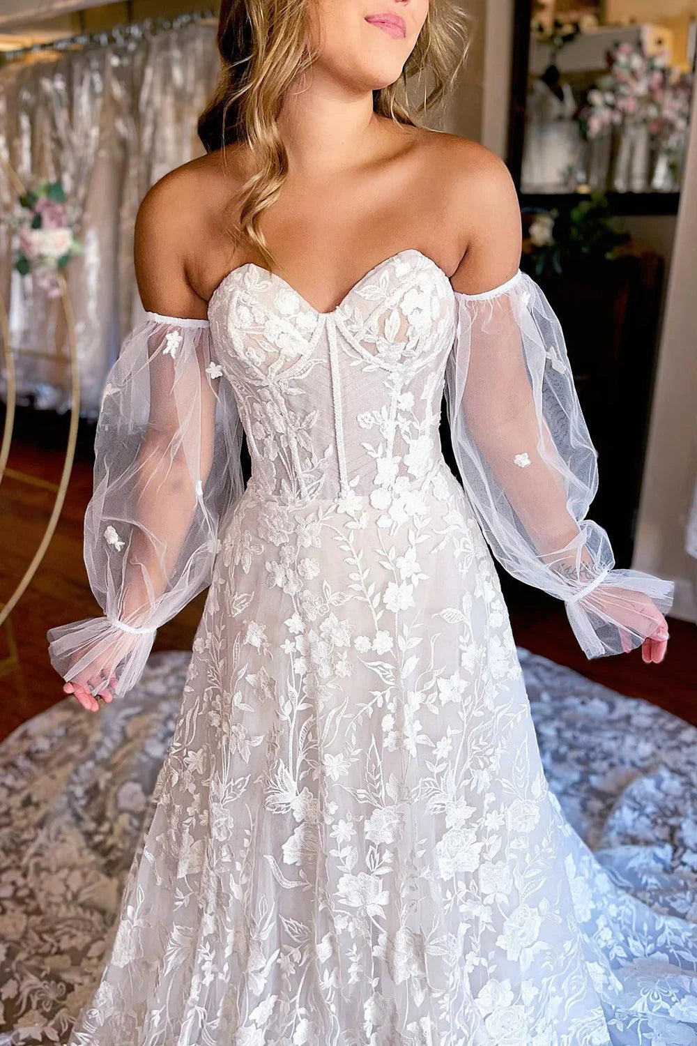 Close-up of the lace and corset bodice on the sweetheart wedding dress.