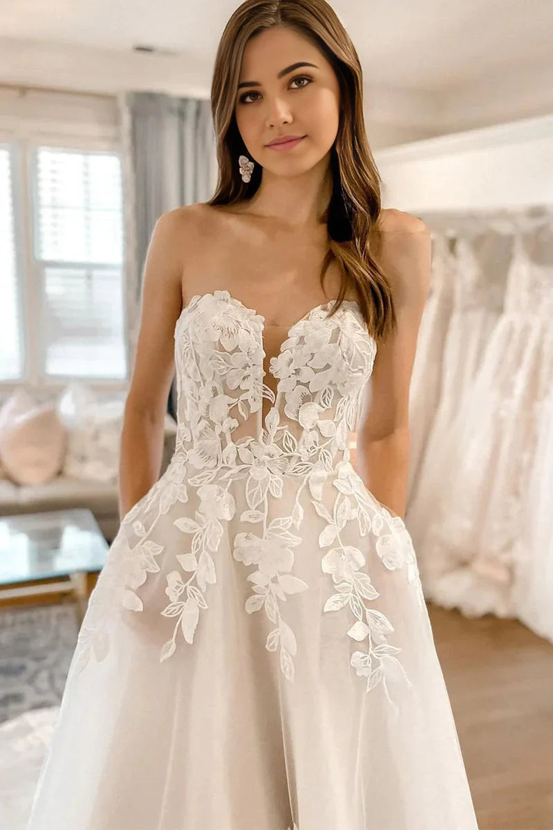 Elegant A-Line sweetheart wedding dress with delicate lace and flowing tulle.