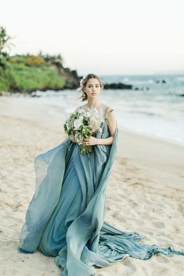 Front view of an A-line V-neck ivory floral chiffon wedding dress.