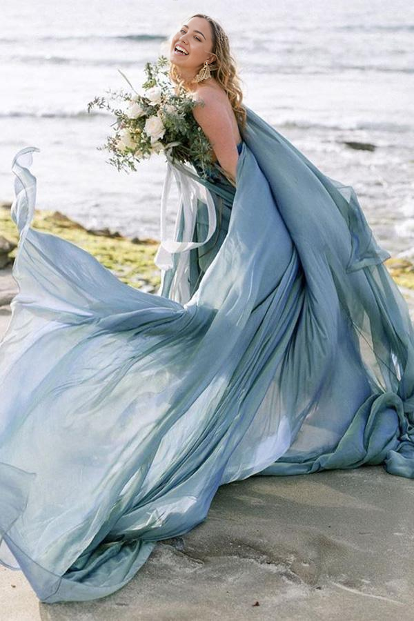 Full length view of an ivory floral A-line wedding dress.