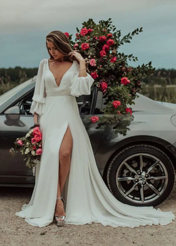 Close-up of the high slit and delicate chiffon fabric on the wedding dress.