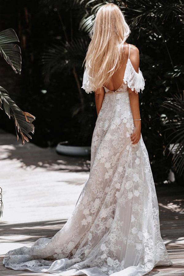 Close-up of the delicate floral lace detail on the wedding dress.
