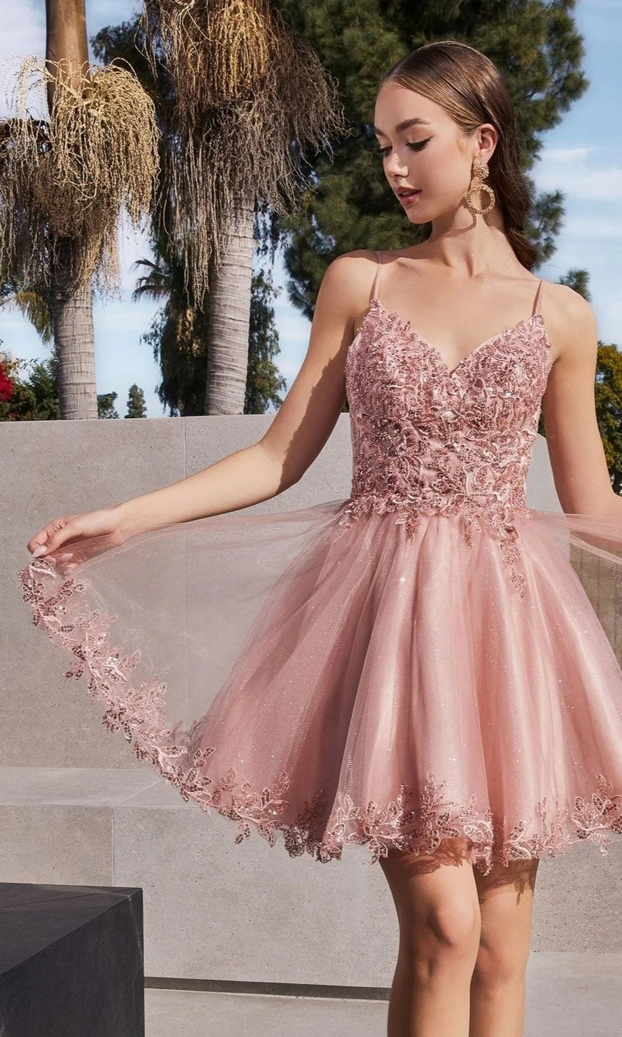 Blush pink floral lace short homecoming dress with spaghetti straps and tulle skirt.