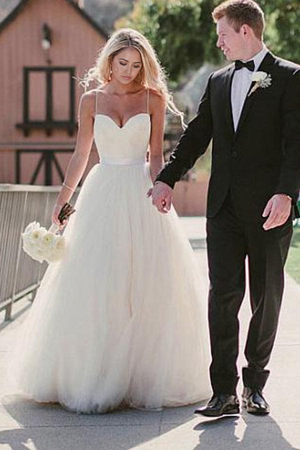 Side view of elegant ivory A-line wedding dress.