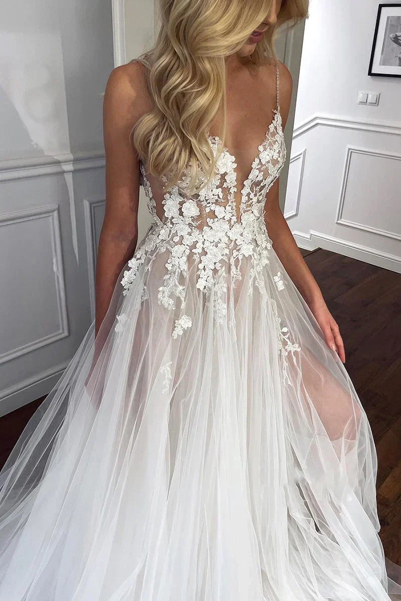 Elegant A-line wedding dress featuring lace appliques and flowing tulle fabric.
