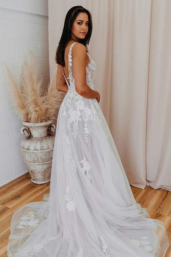 Back view of a romantic A-line bridal gown with V-neck and lace details.