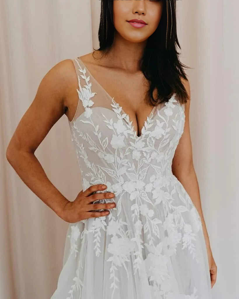 Close-up of lace appliques on a tulle A-line wedding dress.