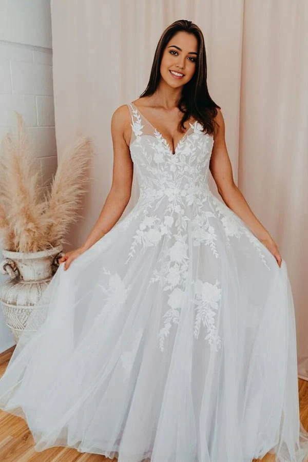 Side view of an elegant A-line V-neck bridal gown.