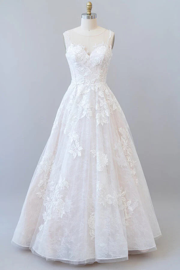 Elegant A-line V-neck wedding dress with lace appliques and tulle skirt.