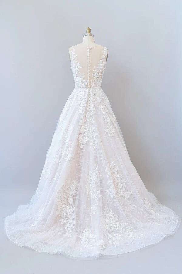 Romantic bridal gown featuring V-neckline and delicate lace details.