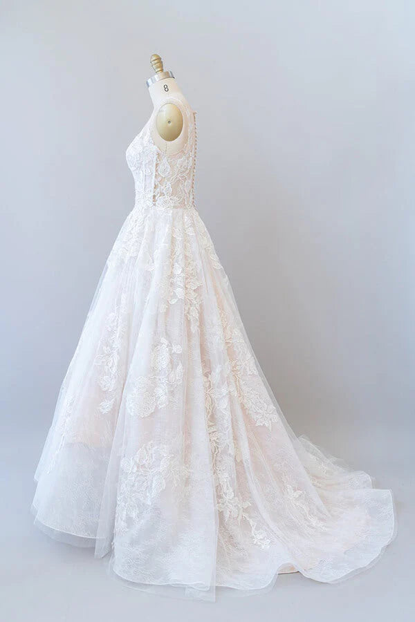 Close-up of lace appliques on a tulle wedding dress.