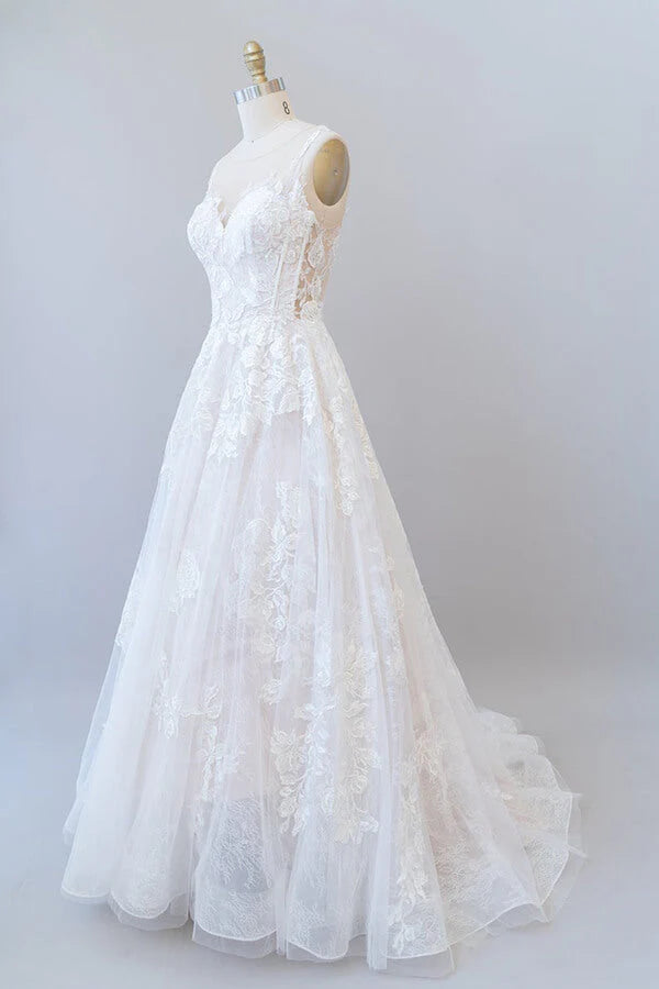 Flowing tulle skirt and A-line silhouette of a wedding gown.