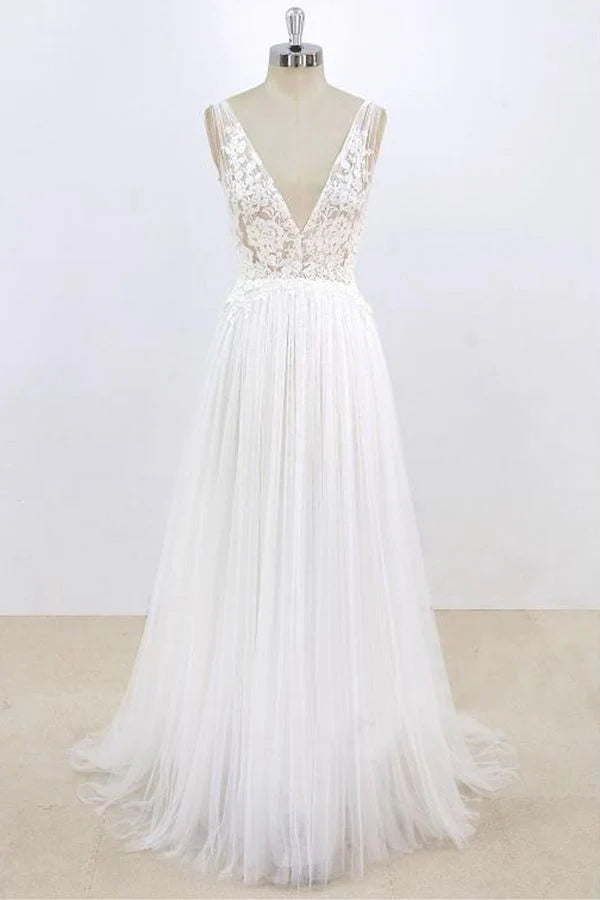 A-line V-neck lace and tulle wedding dress with open back.
