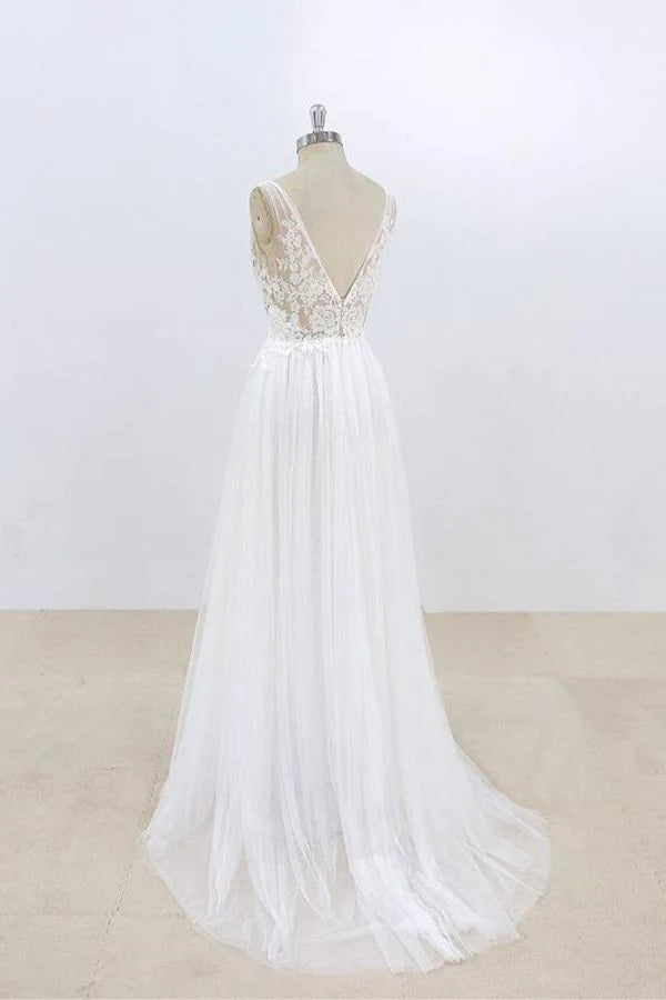 Side view of A-line V-neck wedding dress with flowing tulle skirt.