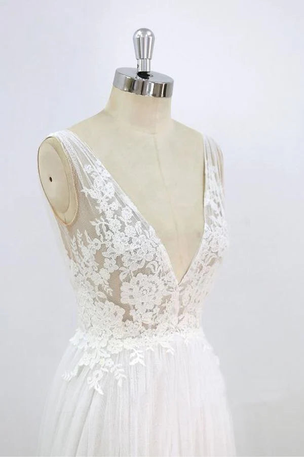 Full length view of A-line V-neck wedding dress on a model.