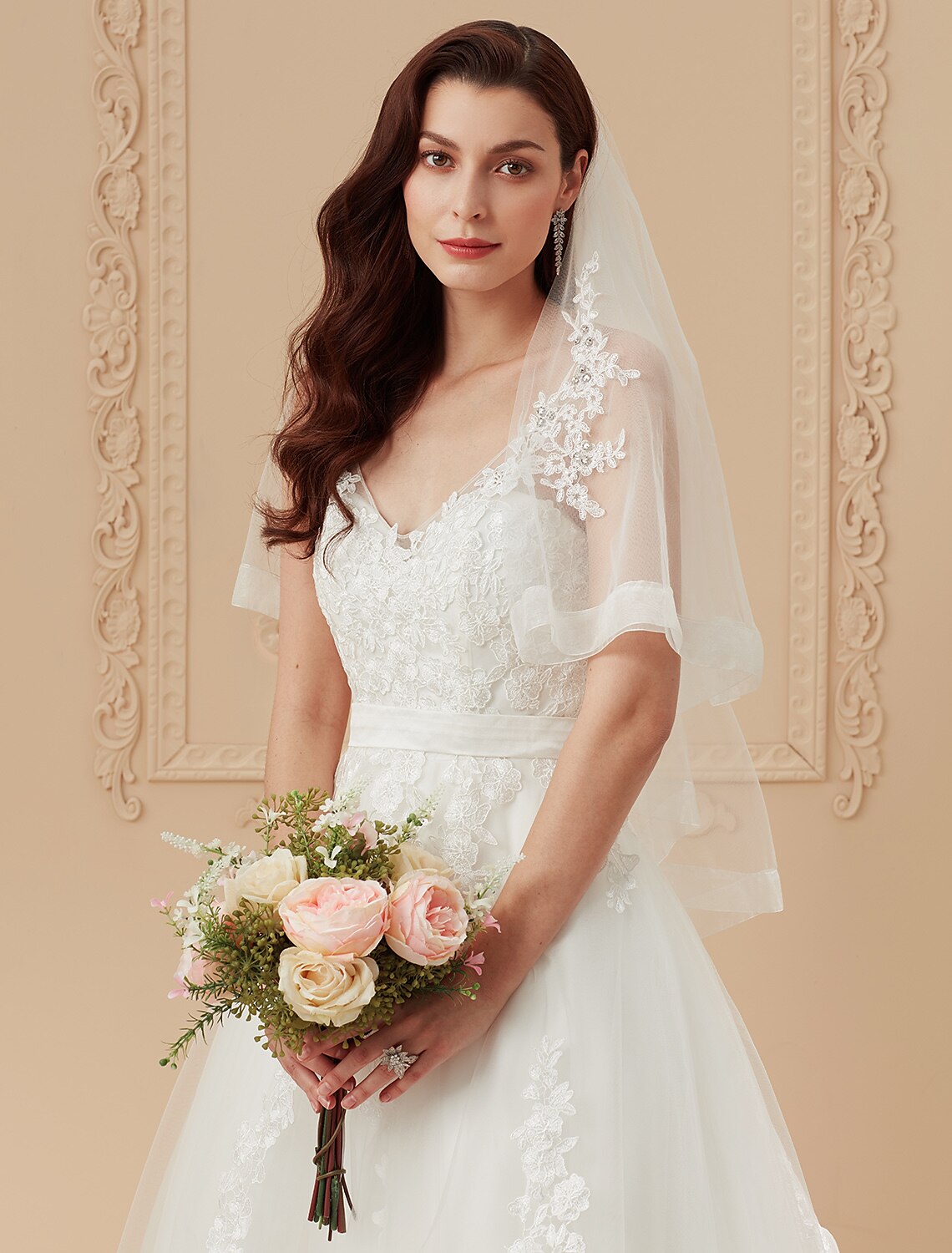 Elegant backless wedding dress with intricate appliques and a voluminous skirt.