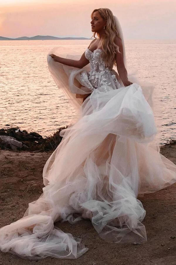 Model wearing a Boho A-line wedding dress with lace appliques.