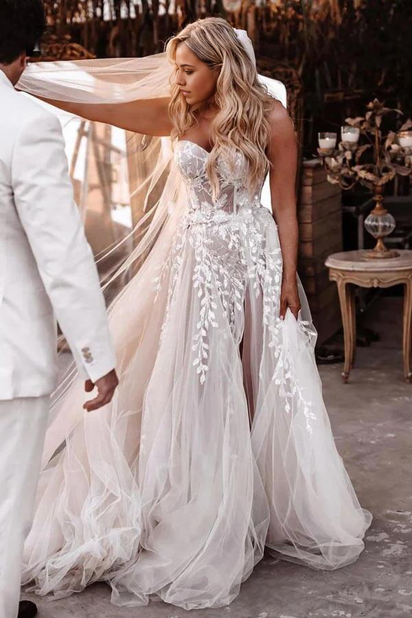Side view of the elegant Boho A-line wedding gown.