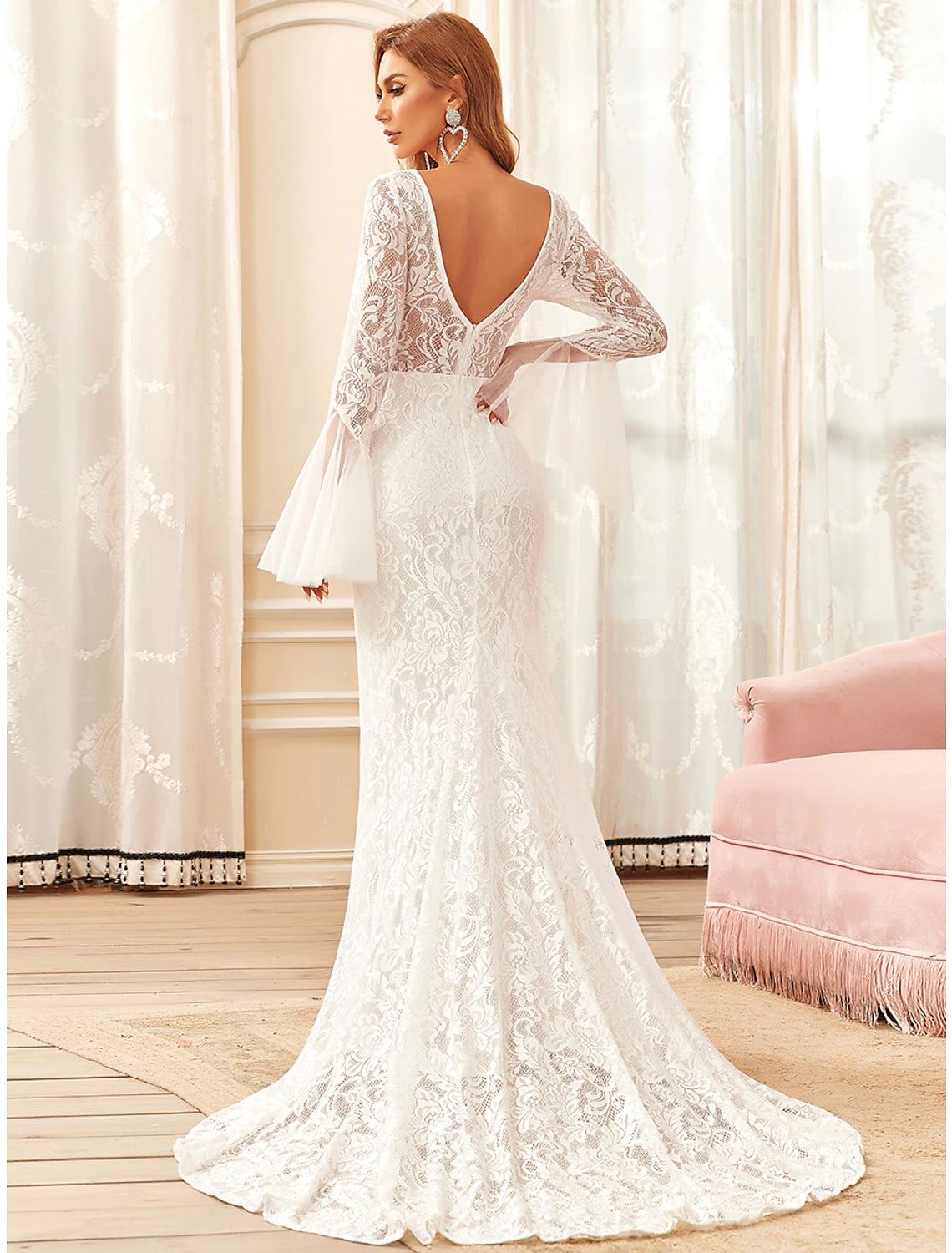 Back view of the mermaid wedding dress showing the sweep train and lace details.