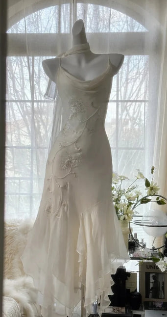 Romantic chiffon mermaid prom dress with delicate straps.
