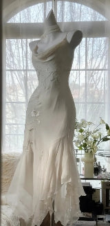 Back view of sleeveless mermaid formal dress.