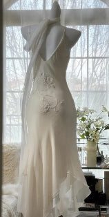 Front view of romantic strappy formal gown.