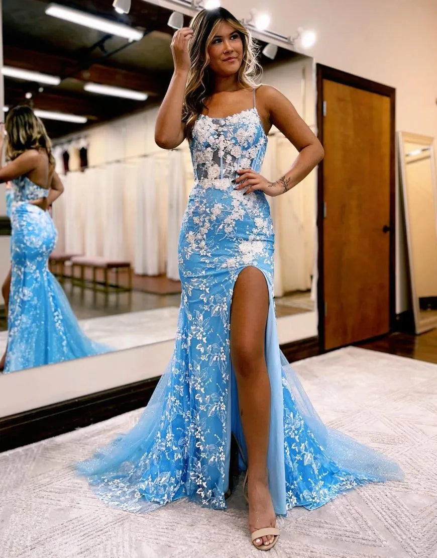 Back view of an elegant mermaid prom dress with intricate appliques and a keyhole design.
