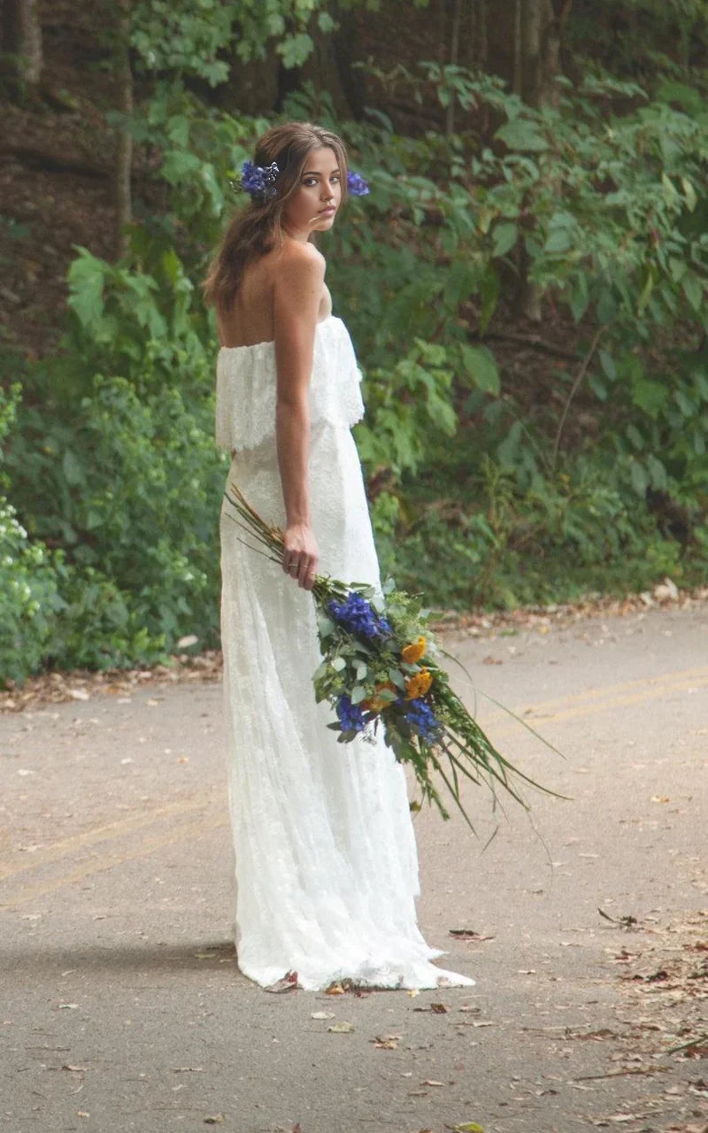 Boho wedding dress with ruffled details and lace.