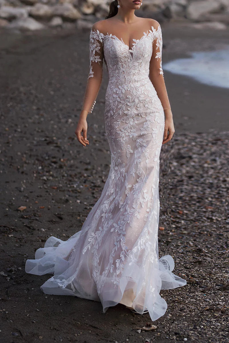 Front view of a romantic white lace mermaid wedding dress with sweetheart off-shoulder neckline and sweep train.