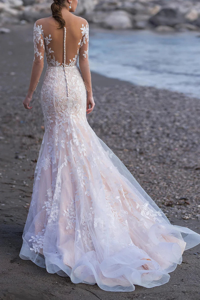 Side view of the lace mermaid wedding dress, highlighting the elegant sweep train and fitted silhouette.
