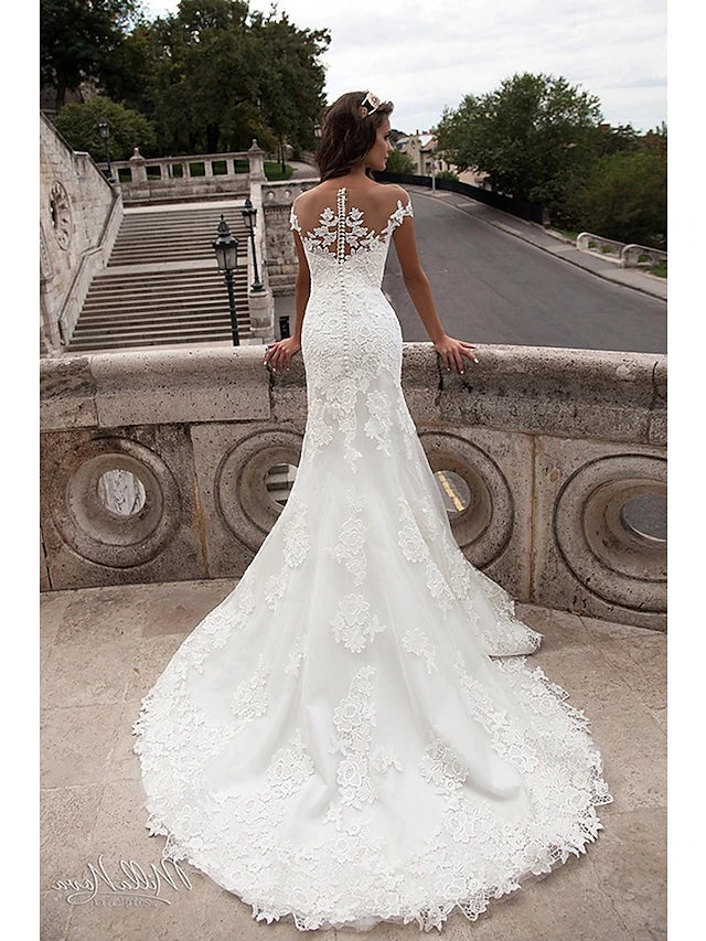 Full length view of a bride wearing the mermaid wedding dress.