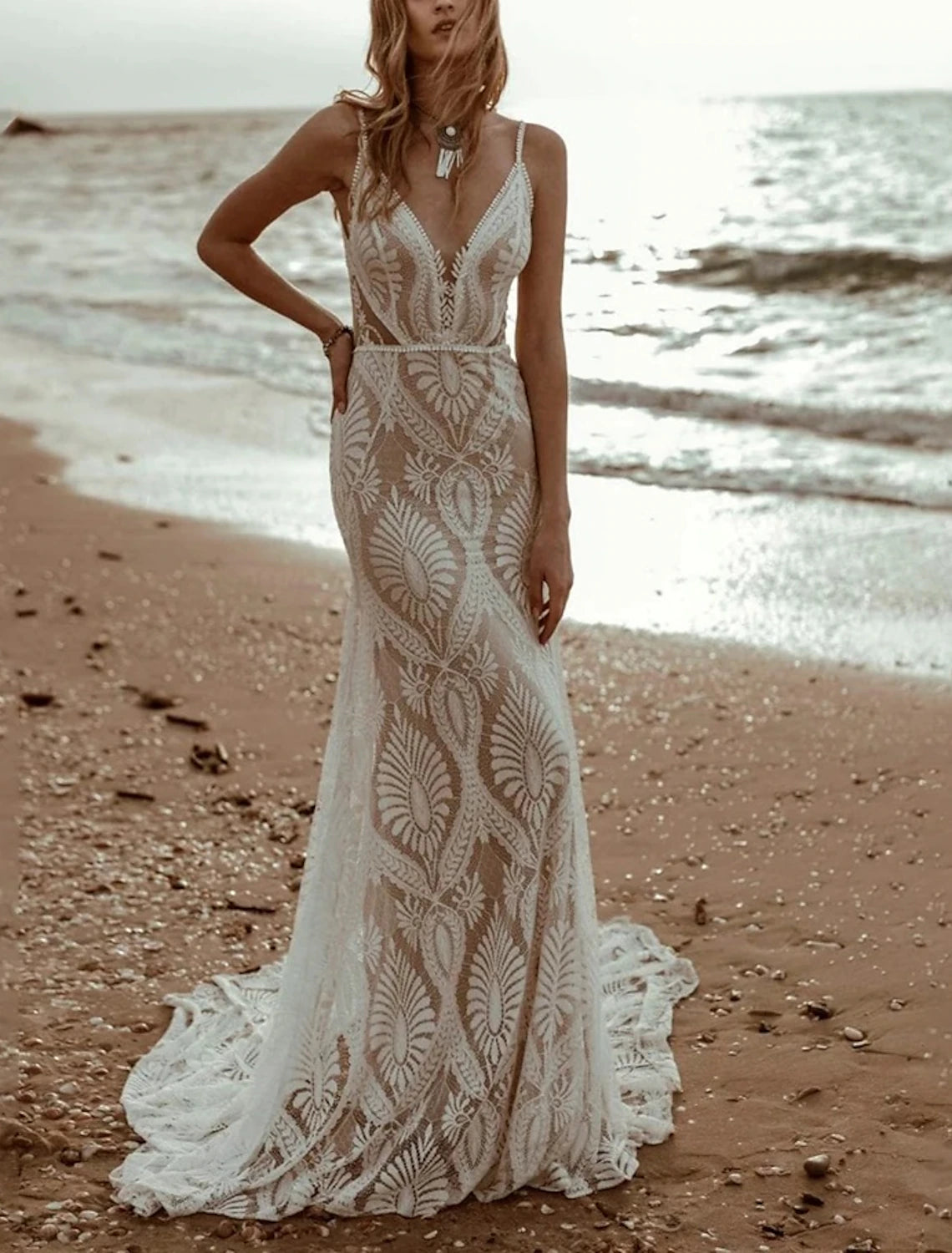 Side view of chiffon mermaid wedding gown with delicate pleats.