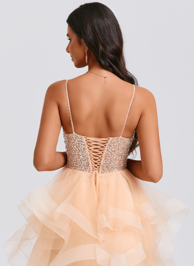 Romantic V-neck short tulle homecoming dress with beading and sequins, side view.