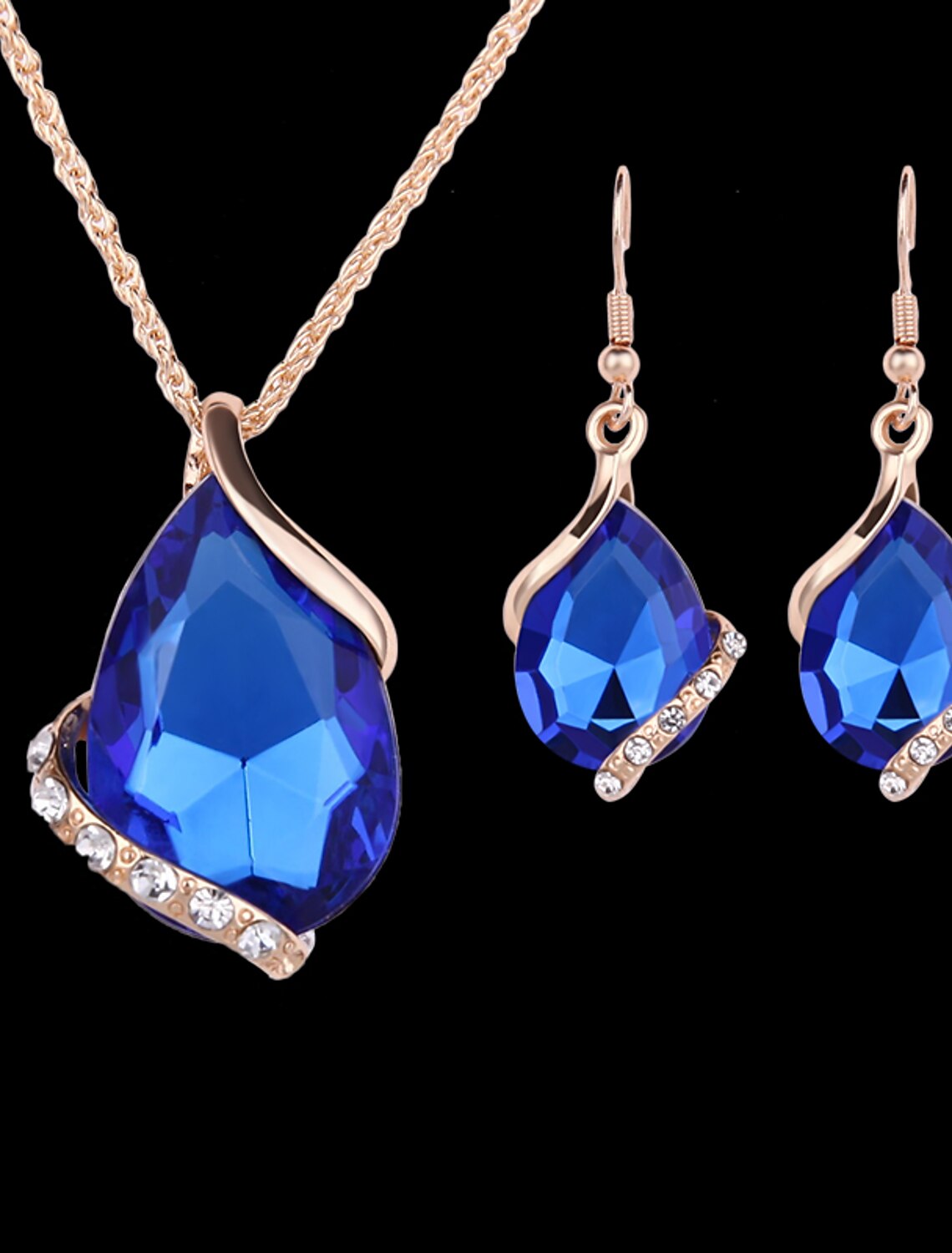 Close-up of rose gold drop earrings with sapphire crystal.