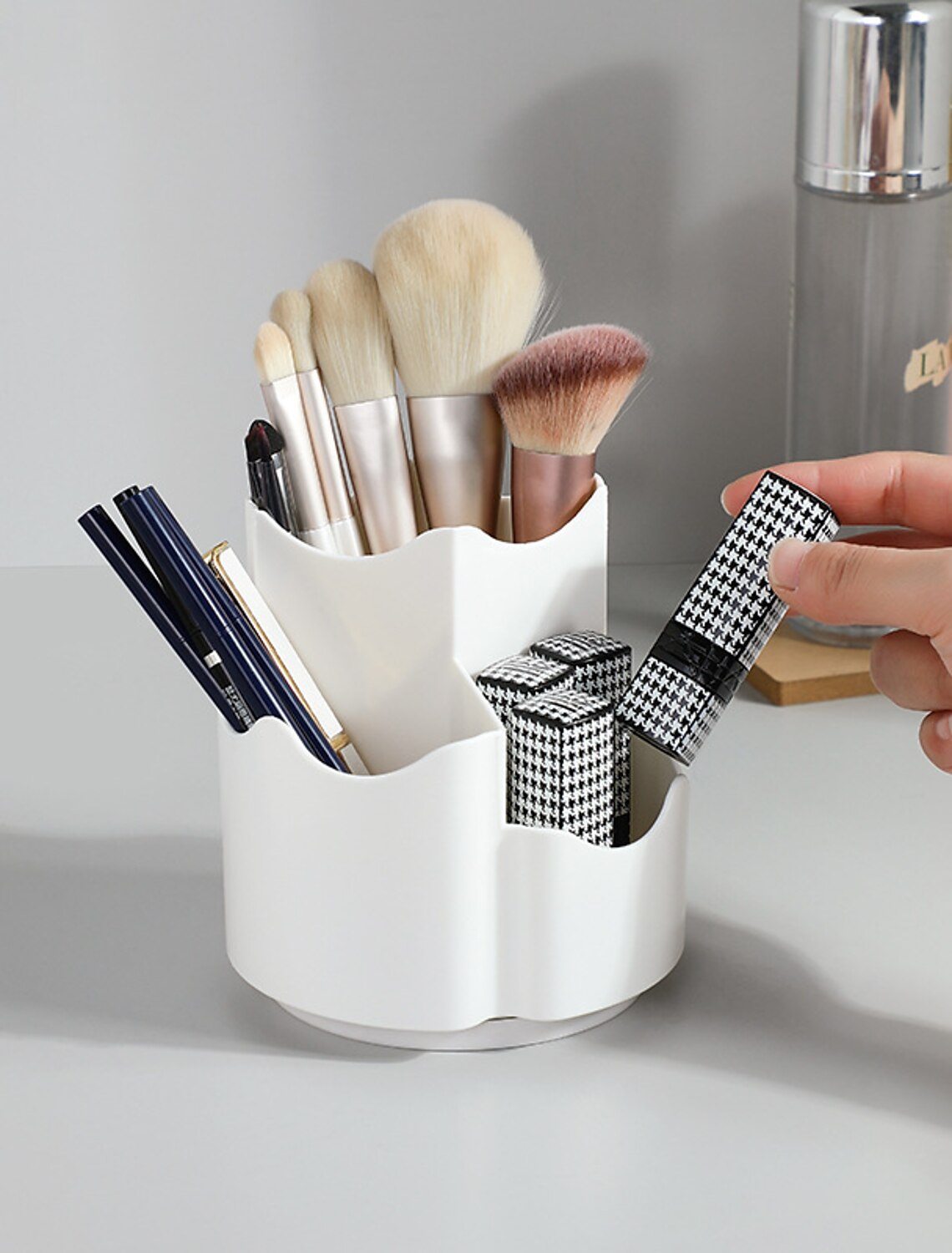 Dust-proof makeup brush holder with clear lid.