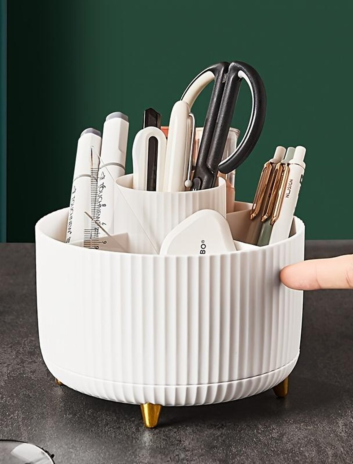 Rotating makeup storage cylinder on a vanity.