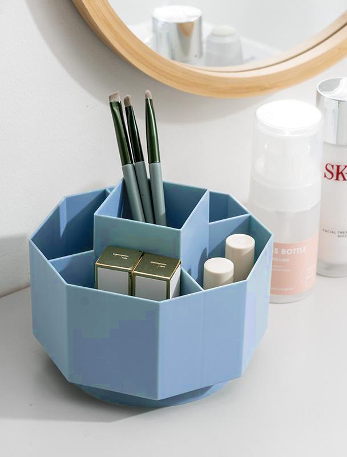 Rotating pen and brush holder filled with stationery.