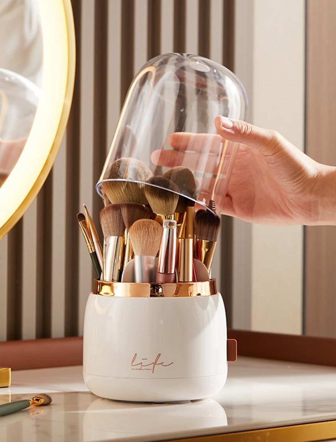 Interior view of the rotating makeup brush holder showing compartments.