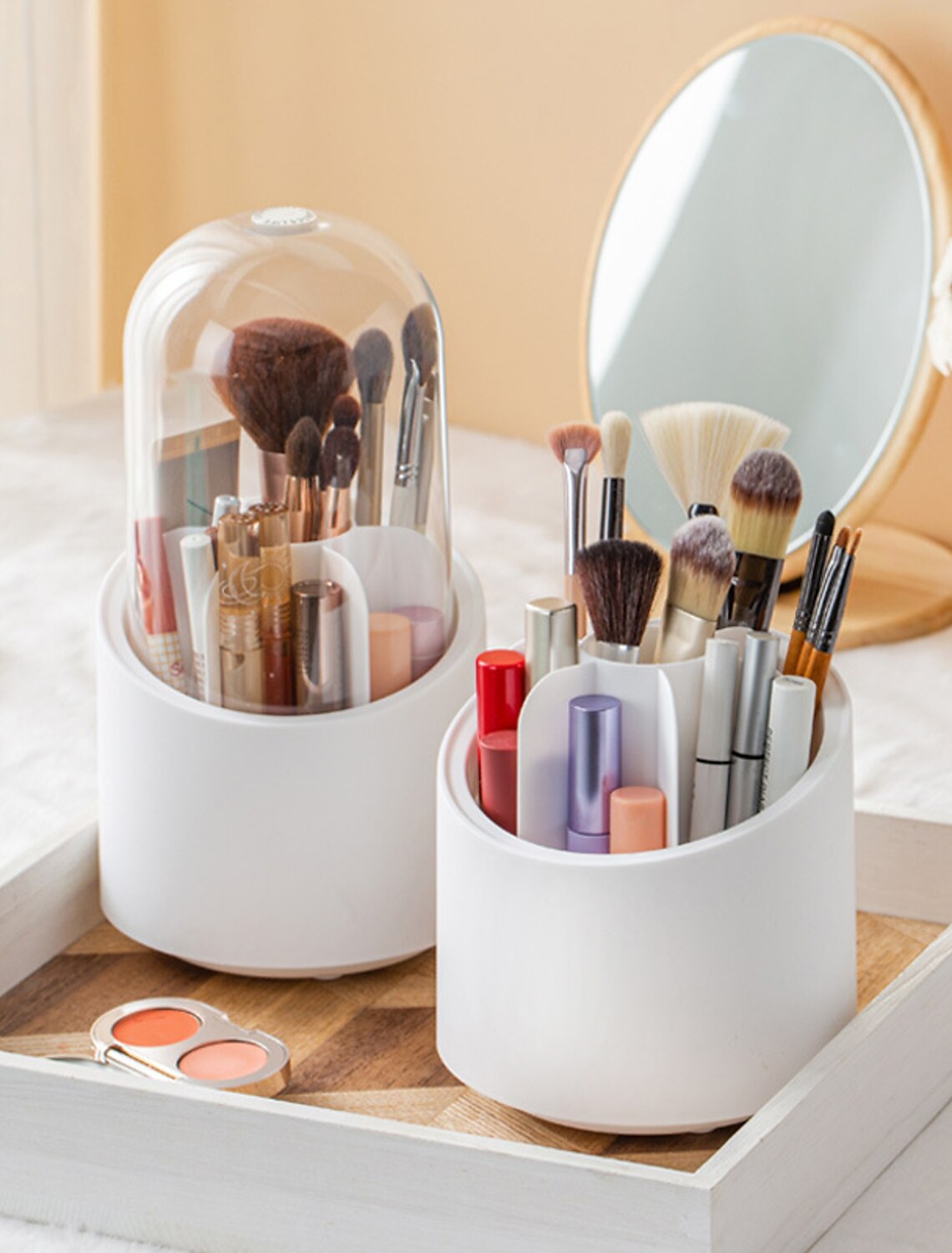 Rotating transparent makeup brush storage box with dust-proof lid.