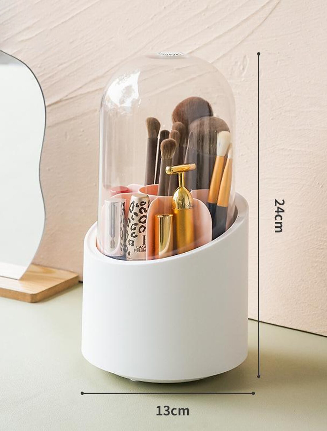 Clear cosmetic organizer rotating on a desktop.