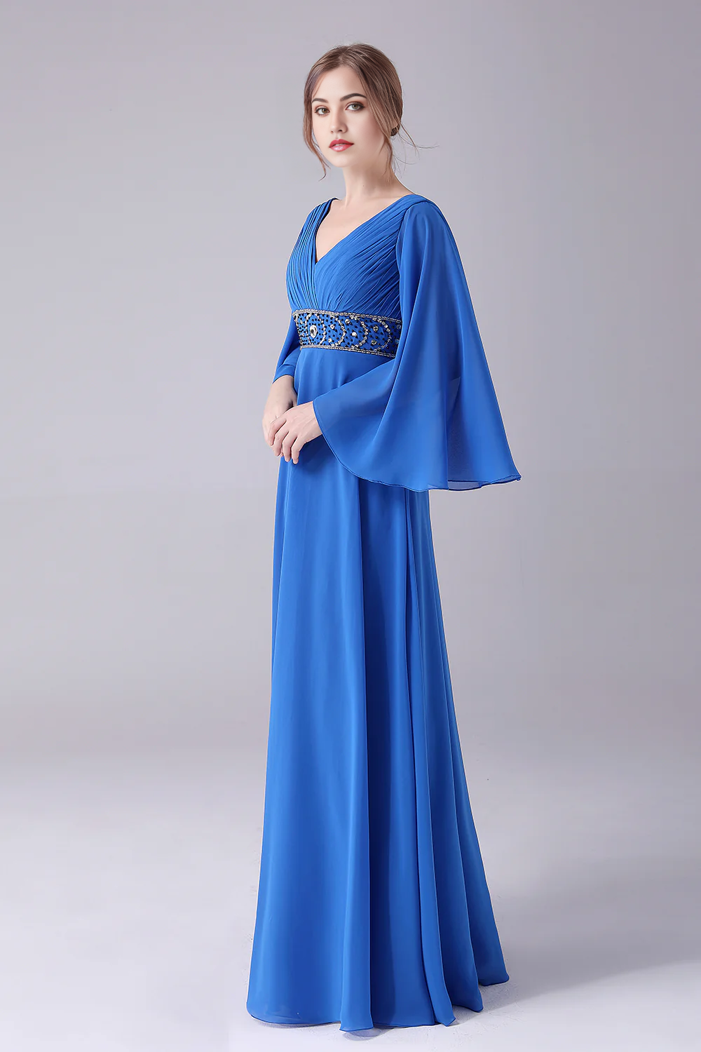 Back view of a floor-length beaded dress.