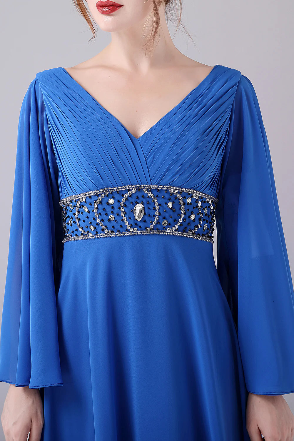 Close-up of beading detail on a blue gown.