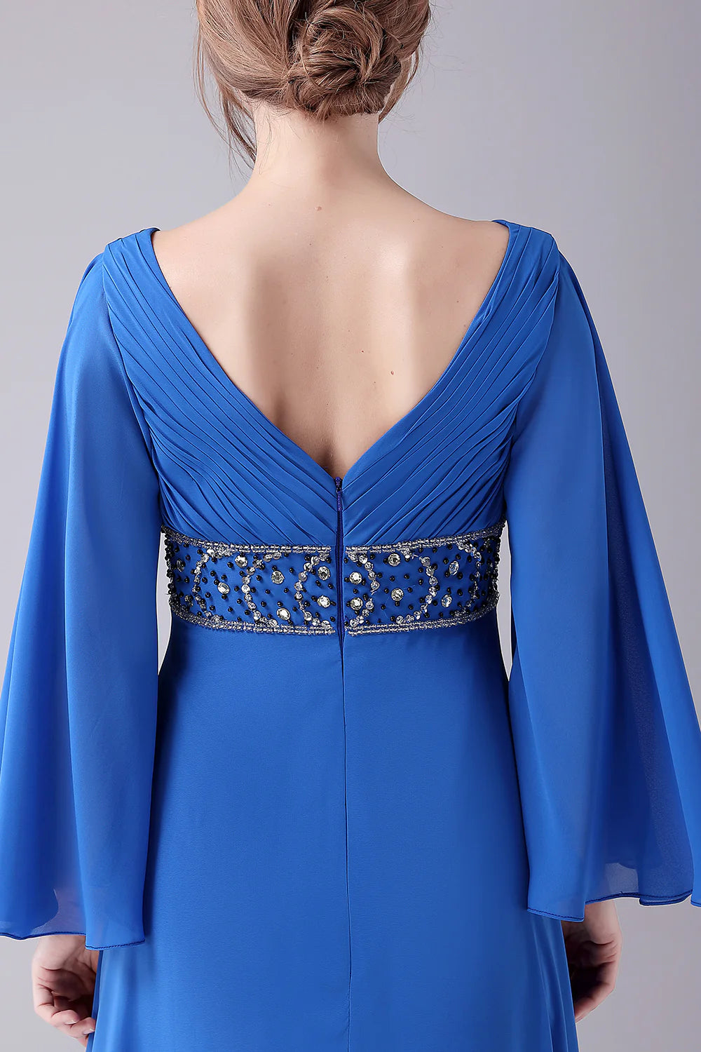 Full length view of the V-neck pleated dress.