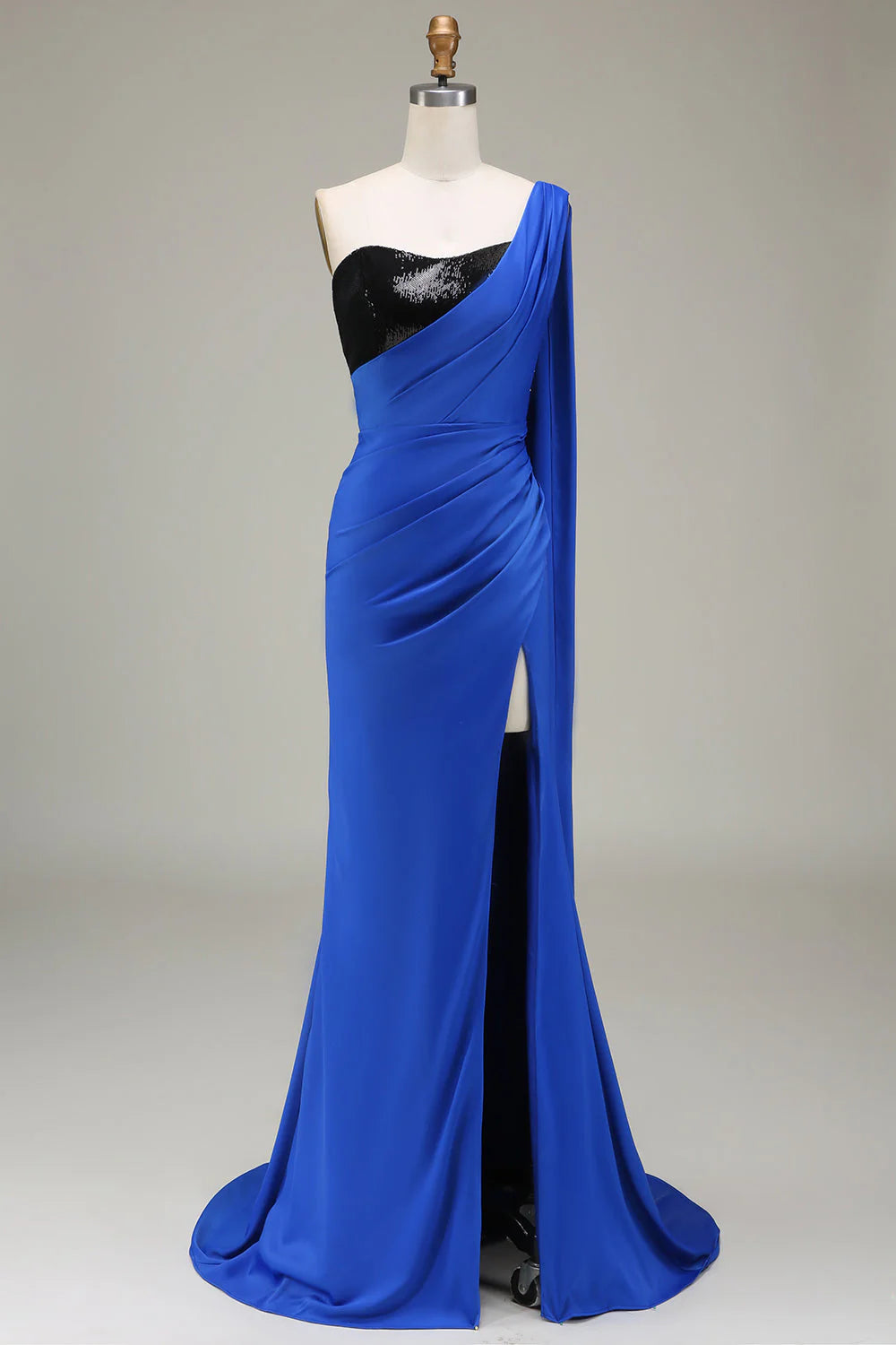 Royal blue one-shoulder mermaid prom dress with a high slit.