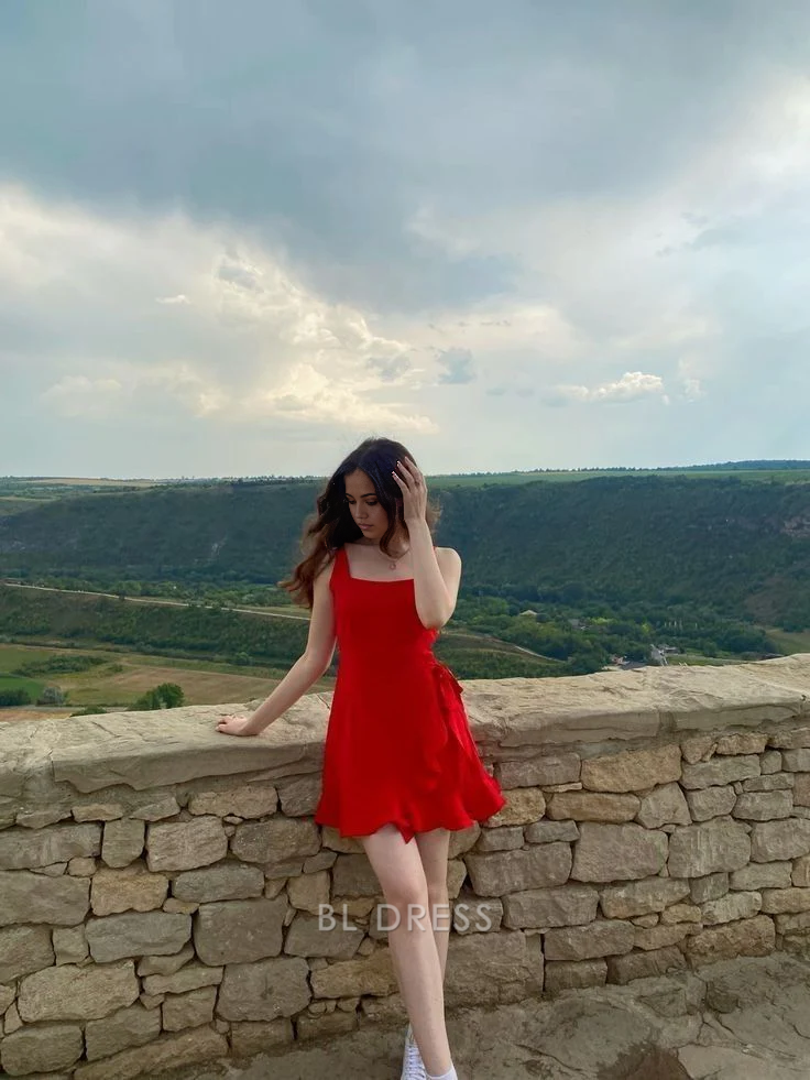 Red A-line short dress with ruffles and V-neckline.