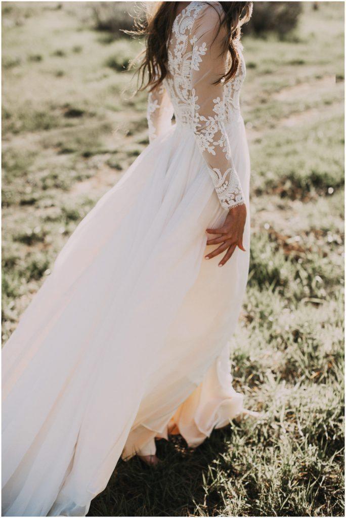 Close-up of lace details on a rustic wedding dress.