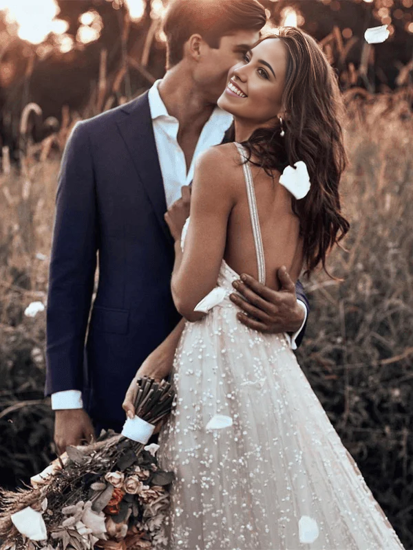Close-up of the intricate lace detail on the A-line wedding dress.