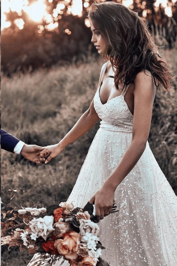 Side view of the A-line wedding dress showcasing its elegant long train.