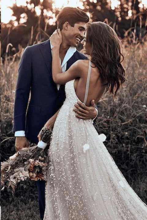 Model wearing the rustic A-line lace wedding dress.